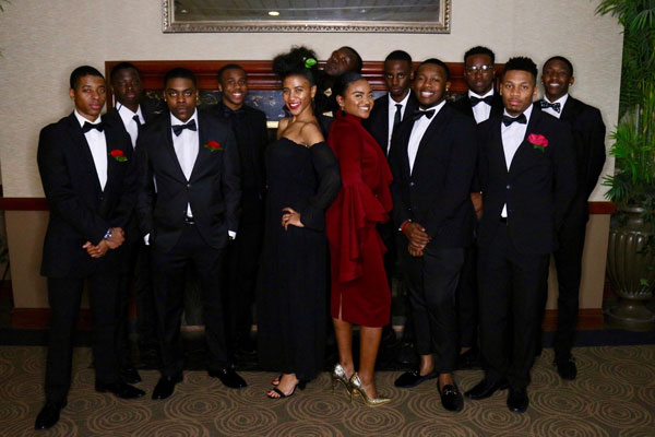 Black men and women in formal attire