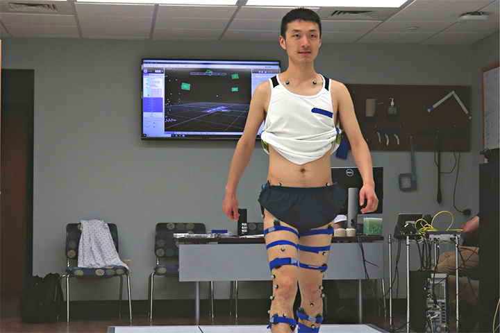 Man testing his gait with sensors attached to him in the Motion Analysis Lab