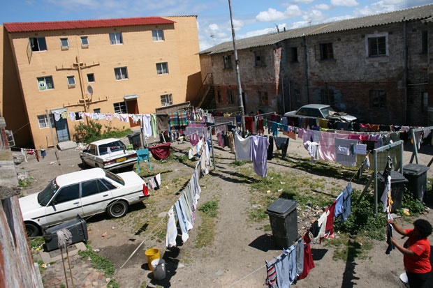 several lines of laundry criss-cross a yard