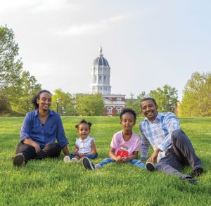 African mother, father and two children on Carnahan Quad